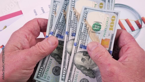 Wallpaper Mural The hands of an elderly accountant sort through US $100 bills and count them. Torontodigital.ca