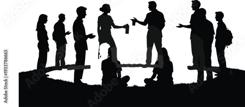 Silhouette of a Diverse Group of People Socializing and Talking Outdoors in a Park Setting at Sunset Representing Community Connection and Youthful Friendship