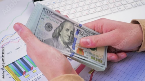 Wallpaper Mural US hundred dollar bills, arranged randomly, slowly rotating. View from above. Torontodigital.ca