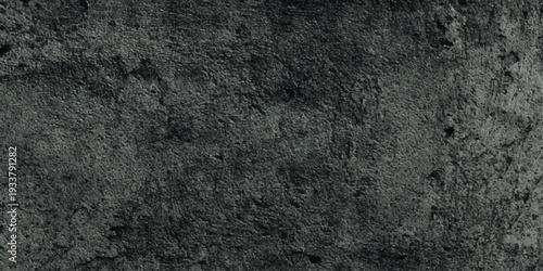 Dark slate wall texture background moody charcoal grey concrete surface natural variations, weathered grain.
