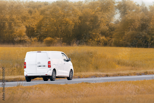 Wallpaper Mural White cargo van driving through a beautiful green landscape Torontodigital.ca