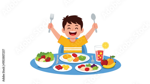 Enthusiastic young boy raises his fork and spoon while sitting at a table full of healthy food and fresh fruit.