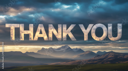 A dramatic mountain landscape with a thank you message in the sky