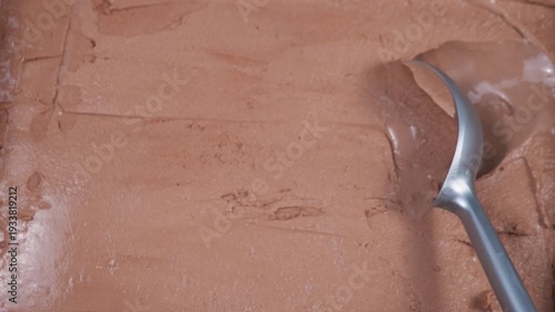 Wallpaper Mural Chocolate ice cream in a metal container, scooped out with a packing spoon. Torontodigital.ca