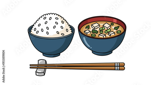 Classic Japanese meal set featuring a bowl of white rice and a bowl of miso soup with tofu and scallions on white background.