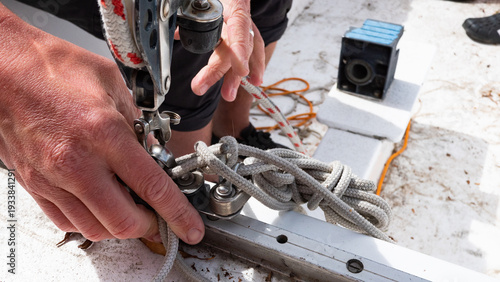 Slika na platnu man hands handling ropes sailing boat close up equipment detailed
