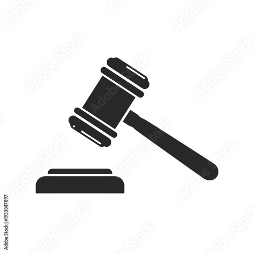 A gavel resting on a desk, symbolizing justice and legal proceedings in a courtroom