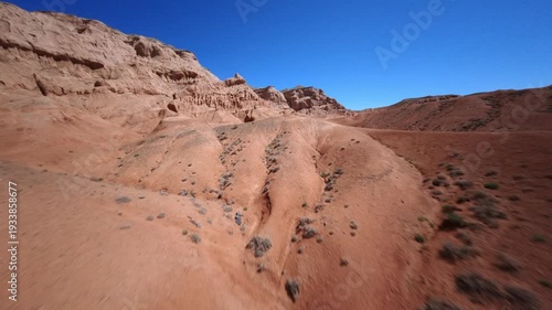 Cinematic FPV Drone Glide Across Red Desert Mountains