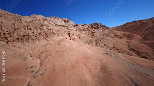 Smooth FPV Aerial Movement Over Desert Badlands