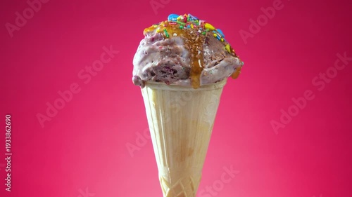 Wallpaper Mural Ice cream in a waffle cone slowly rotates around its axis against a bright background Torontodigital.ca