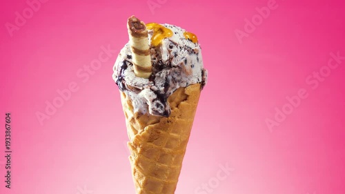 Wallpaper Mural Ice cream in a waffle cone slowly rotates around its axis against a bright background, with fruit syrup slowly poured on top. Torontodigital.ca