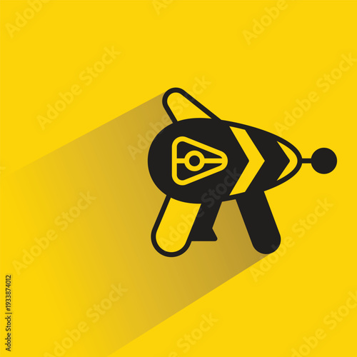space laser gun icon with shadow yellow background