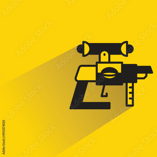 space gun blaster icon with shadow yellow background