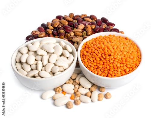 A variety of legumes in white bowls and scattered on a white surface, creating a colorful and wholesome display