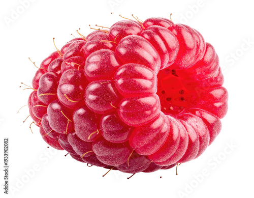 Close-up of a vibrant red, juicy raspberry on a black background