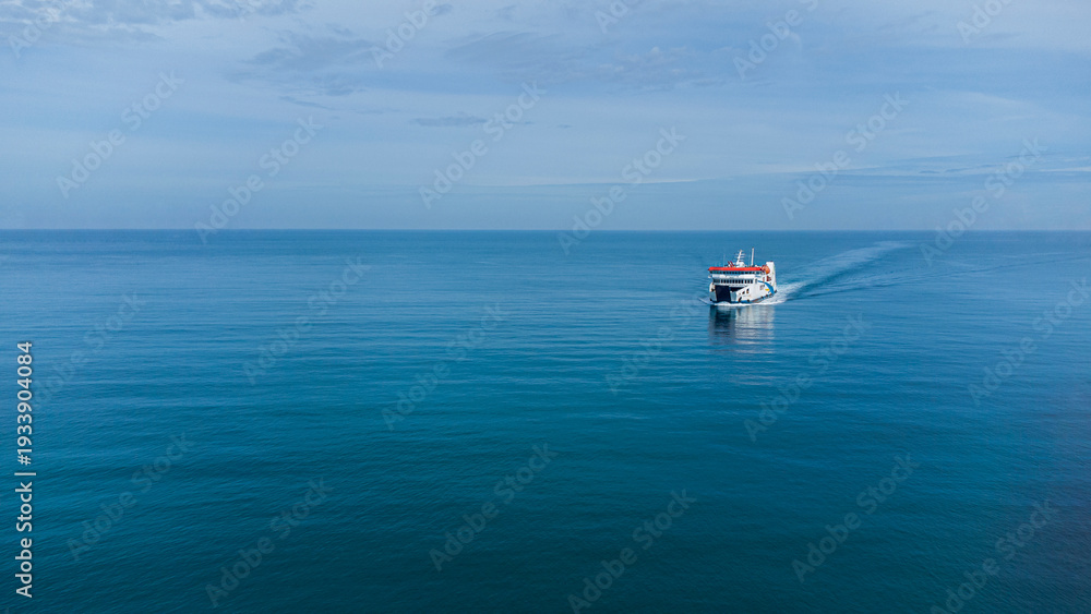 Fototapeta premium Aerial View of Ferry Boat Sailing on Calm Blue Ocean, Minimalist Seascape with Vast Copy Space