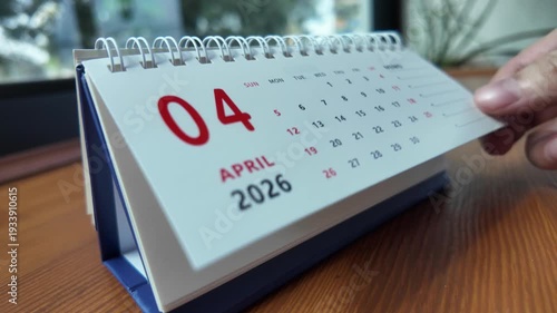 Slow motion footage of flip calendar pages for change months from april to may of the year 2026. concept of planning and starting a new month. 4k horizontal