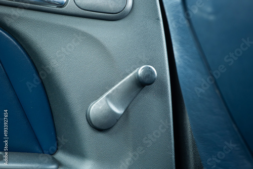 Bild auf Leinwand Manual car window crank handle on interior door panel