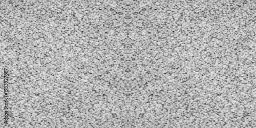 A closeup of a rough gray knitted wool fabric texture with a grunge granite stone pattern and a detailed grey cement material surface for wallpaper design