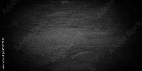 A dark black grunge concrete wall texture provides a vintage scratched stone backdrop with rough gray paper patterns and blank copy space for a dirty textured design surface