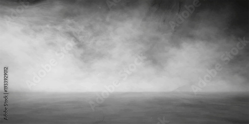 Dramatic black and white grunge background featuring abstract dark storm clouds and swirling mist over a textured grey sky