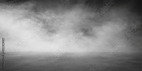 A dramatic black and white cloudscape of dark stormy clouds creates an abstract nature background filled with gray fog and motion