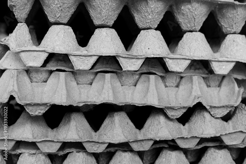 Close up texture of stacked recycled paper egg trays or egg cartons.