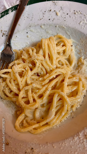 Close-up of traditional Italian pasta dish from Roman cuisine.