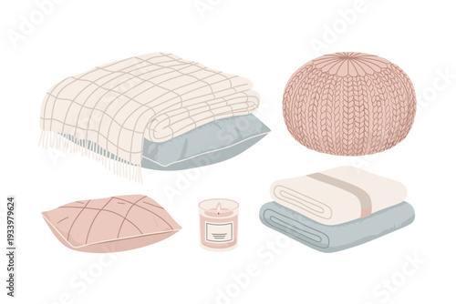 Cozy home decor elements including blankets, pillows, a knitted pouf, and a scented candle, creating a warm and inviting atmosphere.