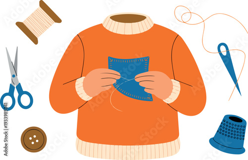 Person mending a torn orange sweater with a blue fabric patch and needle at a table surrounded by sewing tools