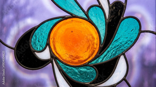 Abstract stained glass with orange circle, teal and white curved segments. Symbolizes artistic expression, creativity, and decorative glasswork