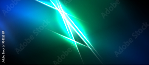 Abstract light streaks radiate from central point. Blue, green hues blend, creating dynamic visual effect. Energy flows, vibrant.
