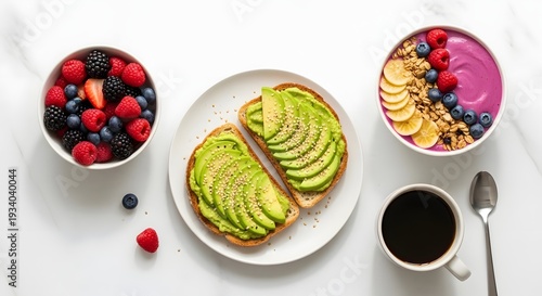 Overhead view displays healthy breakfast of avocado toast alongside bowls of fresh berries and vibrant açaí smoothie ready for.