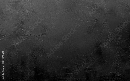 Black decorative plaster texture with vignette. Abstract grunge background with copy space for design. Black smooth textured wall background