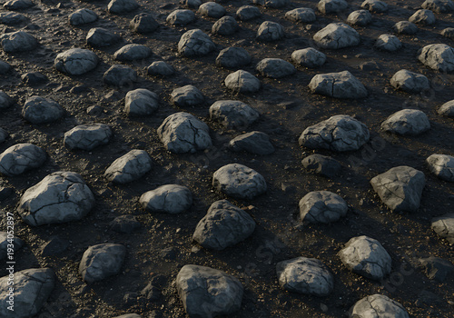 A vast expanse of small rocks scattered across a dark surface, illuminated by a subtle light source.
