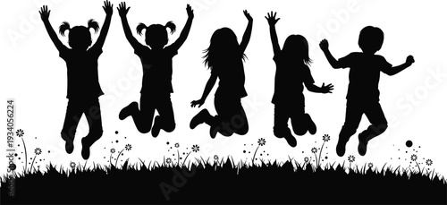 Black silhouettes of happy children jumping in garden grass field