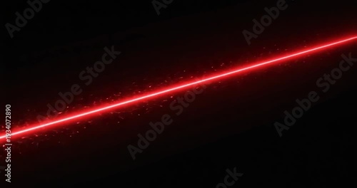 Red laser light beam in darkness.