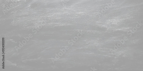 A vintage grey grunge paper texture featuring a rough surface and blank canvas pattern creates a faded black and white backdrop with an old cement wall design