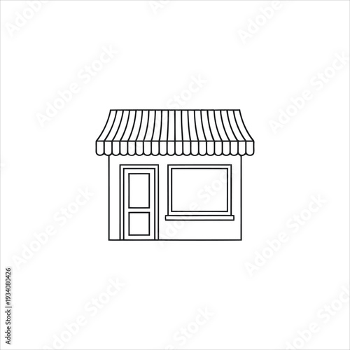 A small shop with a striped awning and a window