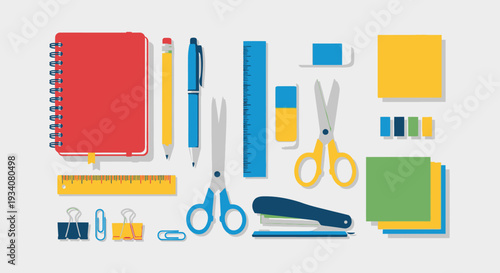 Flat lay of stationery items including notebook pens scissors and paper