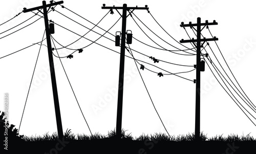 Silhouette utility poles with transformers, insulators, sagging power lines, leaning structures, outdoor grass landscape, electrical infrastructure, telecommunications network, urban system