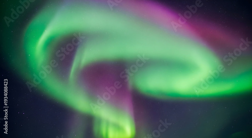 Spectacular Aurora Borealis Display with Green and Purple Lights Dancing in the Starry Night Sky