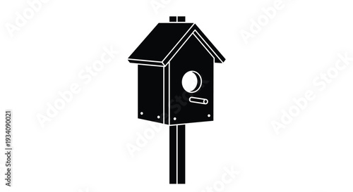 Simple black silhouette icon of a wooden birdhouse with a round entrance, mounted on a post, isolated on a white background.