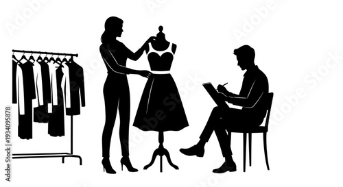 Fashion designer presents dress on mannequin to seated colleague near clothing rack