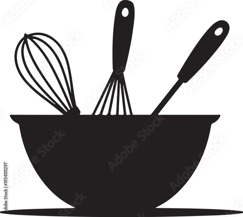 Black bowl with whisk and spatula kitchen cooking