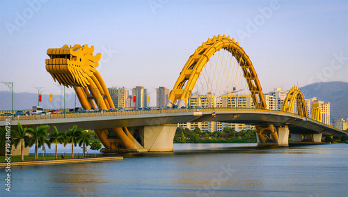 Schilderij op canvas Dragon Bridge in Da Nang, Vietnam with golden dragon architecture over water