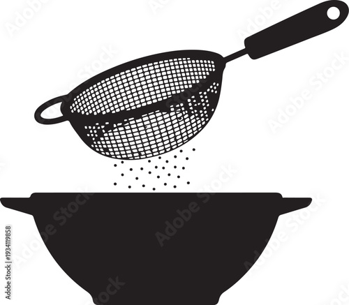 Black strainer pouring into bowl kitchen