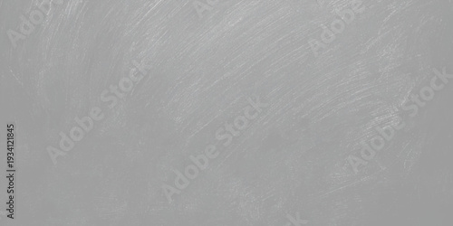 A blank brushed metal plate features a silver steel texture with a light gray pattern on a rough industrial surface, creating a seamless metallic backdrop design for a modern grunge wallpaper