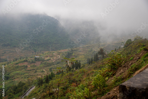 Принти на полотні Quiet village beneath cloudy valley