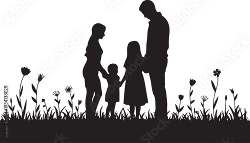 Black silhouette family with two children standing in grass with